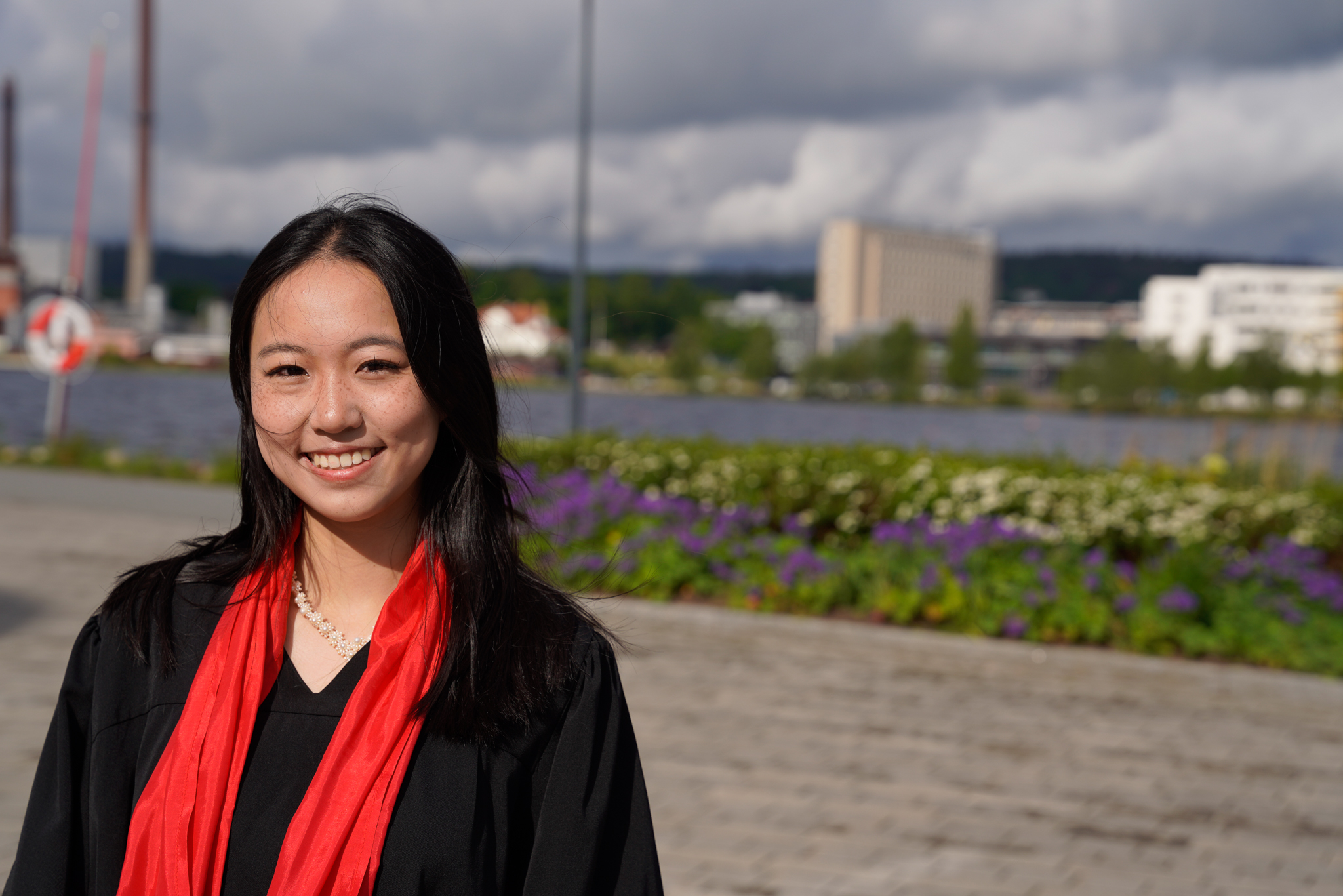 Elaine Chen looking in to the camera on her graduation day.