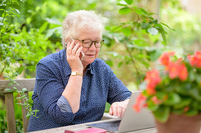 A older woman at a computer