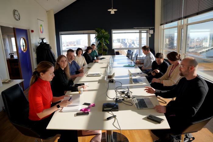 Group of people around a boardroom table