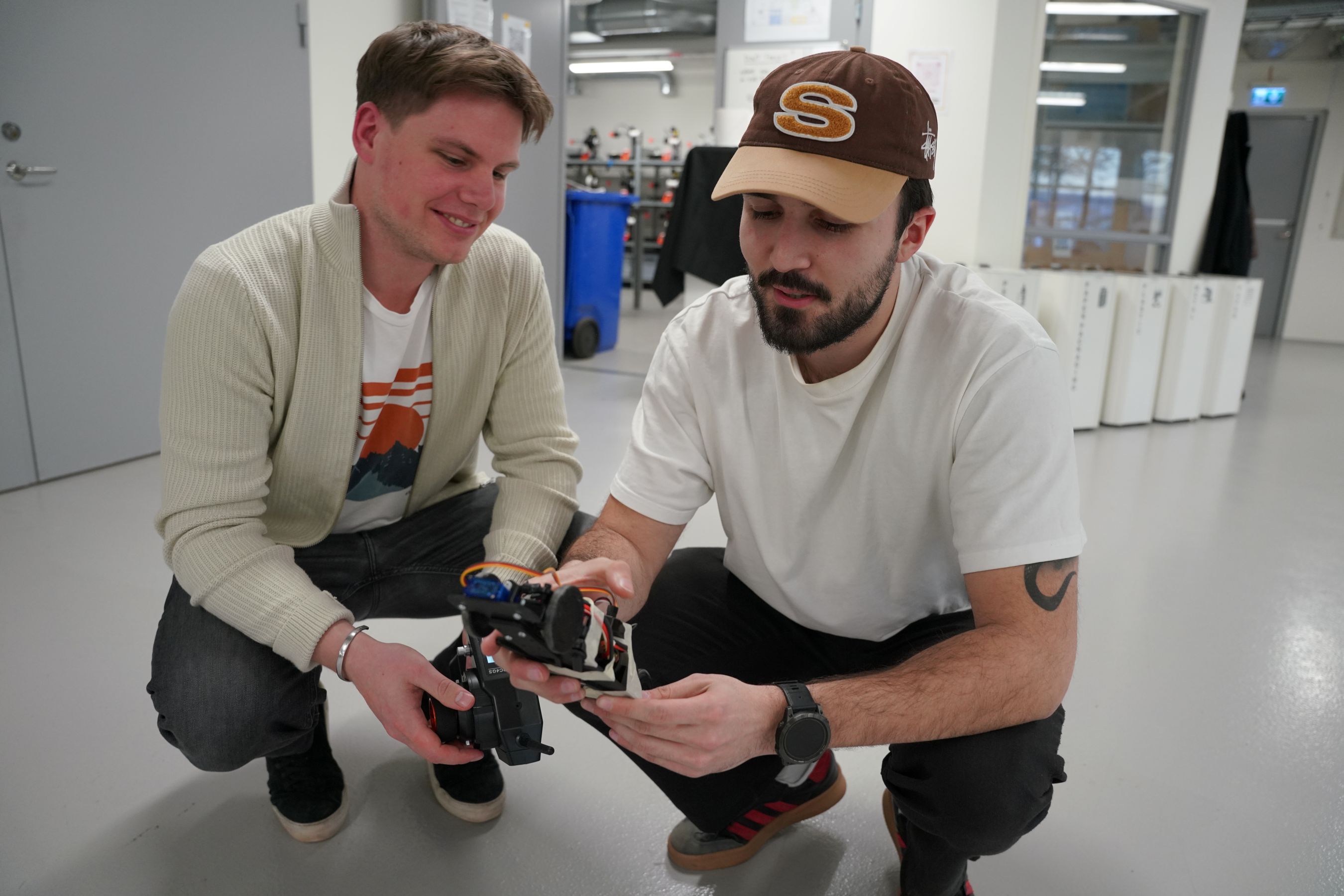 Two men and a toy car.